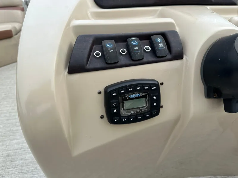 Slide: The Image of Dashboard of a 2018 South Bay S224CR with switches and controls. - 12