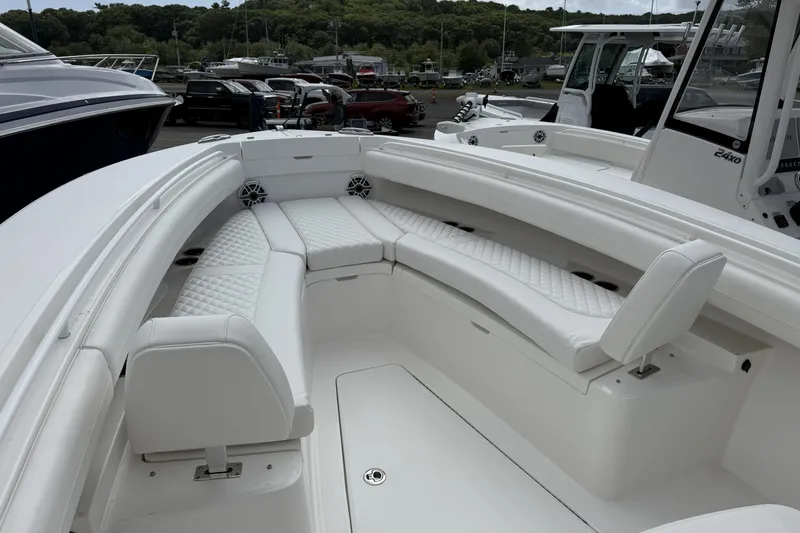 Slide: The Image of 2026 Regulator 25 boat with luxurious white seating and sleek design. - 13