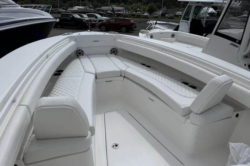 Slide: The Image of 2026 Regulator 25 boat interior with white cushioned seating and sleek design. - 15