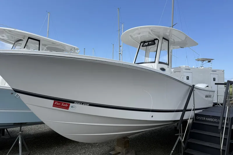The Image of 2026 Regulator 25 boat for sale, displayed on a dock with clear blue sky. - 0