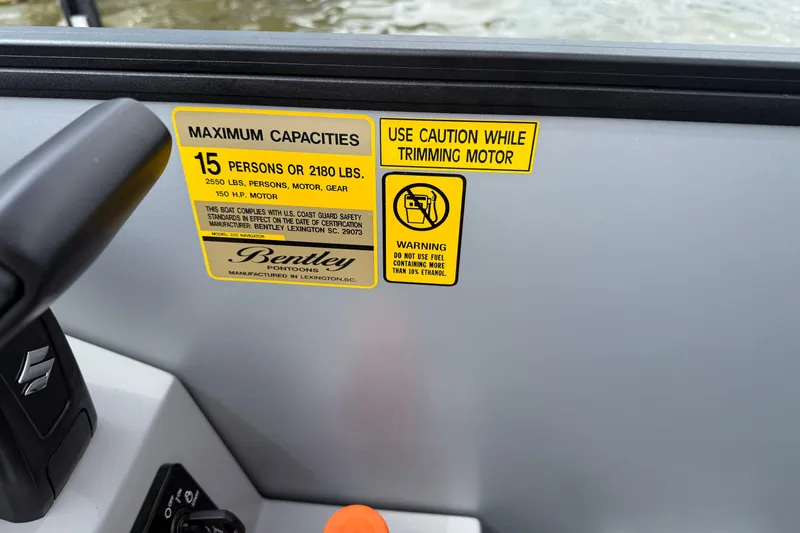 Slide: The Image of Safety labels on 2026 Bentley Pontoons Legacy 220 Navigator, detailing capacity and fuel warnings. - 7