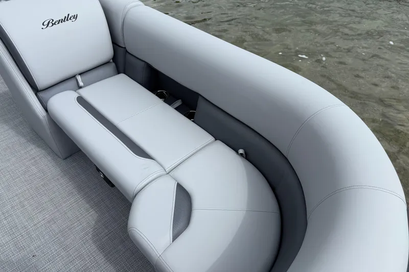 Slide: The Image of 2026 Bentley Pontoons Legacy 220 Navigator with luxurious seating on water. - 5