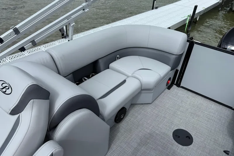 Slide: The Image of 2026 Bentley Pontoons Legacy 220 Navigator interior with gray seating and modern design. - 8