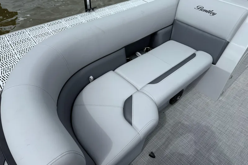 Slide: The Image of Luxurious seating on 2026 Bentley Pontoons Legacy 220 Navigator, featuring elegant gray upholstery. - 4