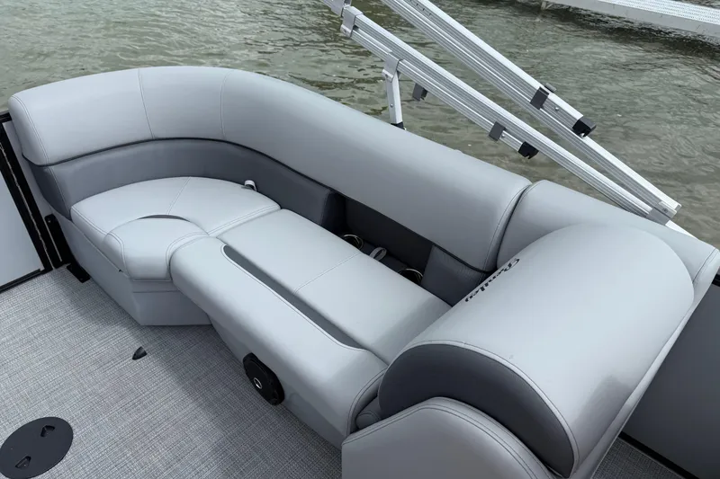 Slide: The Image of Luxurious seating on 2026 Bentley Pontoons Legacy 220 Navigator, featuring sleek gray upholstery. - 9