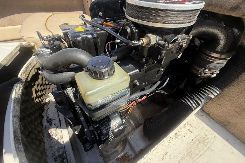 Slide: The Image of Engine compartment of a 2001 Sea Ray 180 Bow Rider boat, showcasing mechanical components. - 8