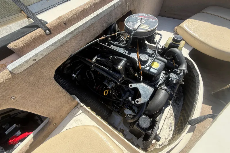 Slide: The Image of Engine compartment of a 2001 Sea Ray 180 Bow Rider boat, showcasing the motor. - 3