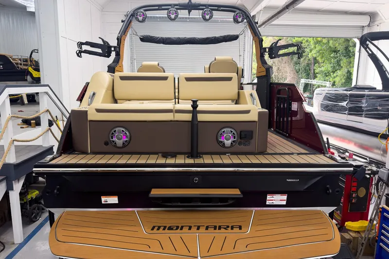 Slide: The Image of 2026 Montara Surf Boss EVO - SL 25' boat interior with beige seating and speakers. - 3