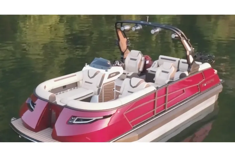 The Image of 2026 Montara Surf Boss EVO - SL 25' boat on calm water, featuring sleek red design. - 0