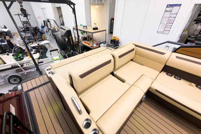 Slide: The Image of Luxurious seating on the 2026 Montara Surf Boss EVO - SL 25' boat in a workshop setting. - 22