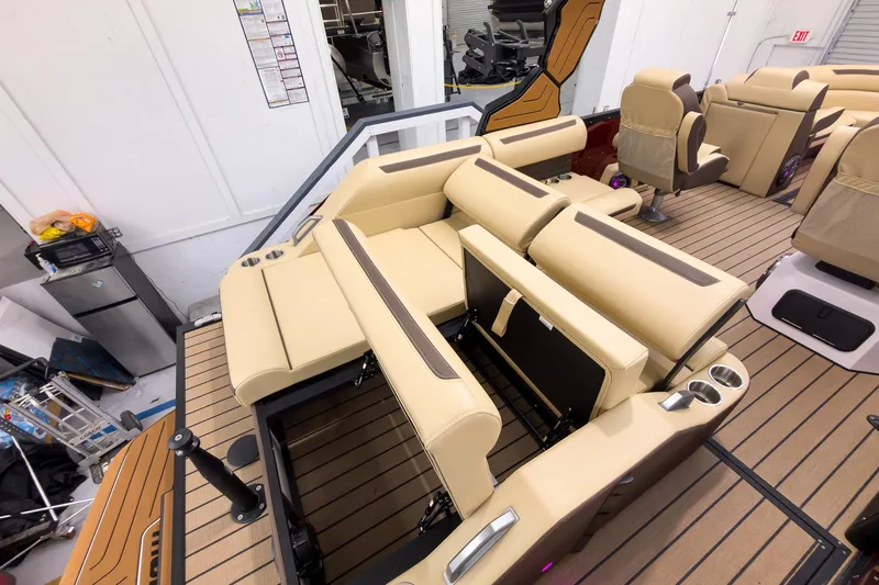 Slide: The Image of Luxurious interior of 2026 Montara Surf Boss EVO - SL 25' boat with beige seating. - 25
