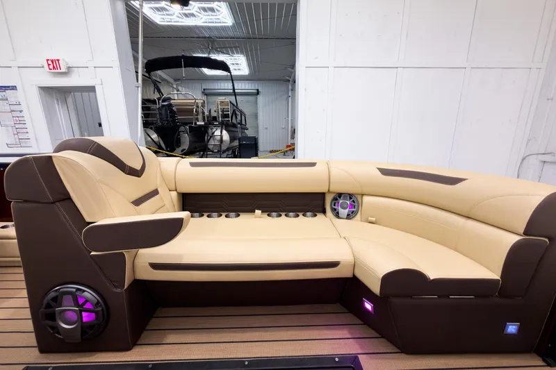 Slide: The Image of Luxurious seating on 2026 Montara Surf Boss EVO - SL 25' boat, featuring modern design and speakers. - 11