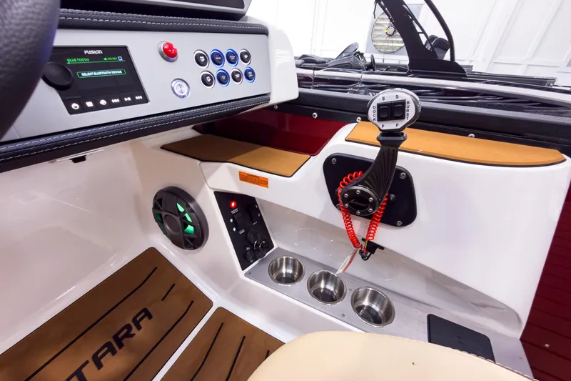 Slide: The Image of Interior of 2026 Montara Surf Boss EVO - SL 25' boat with control panel and cup holders. - 16