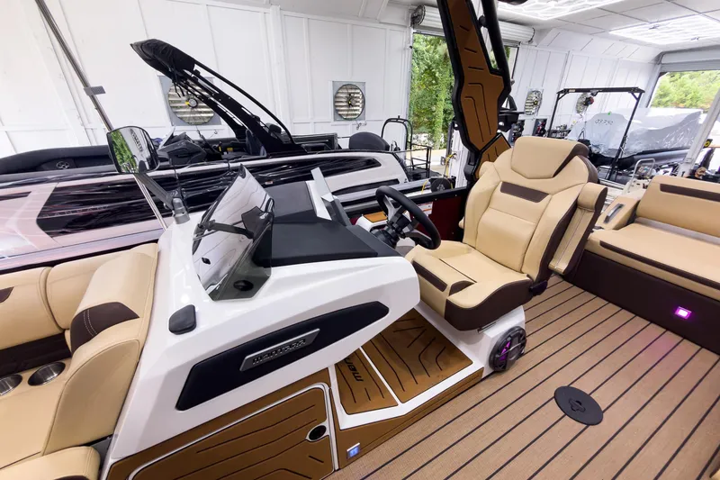 Slide: The Image of 2026 Montara Surf Boss EVO - SL 25' boat interior with luxurious seating and modern dashboard. - 14