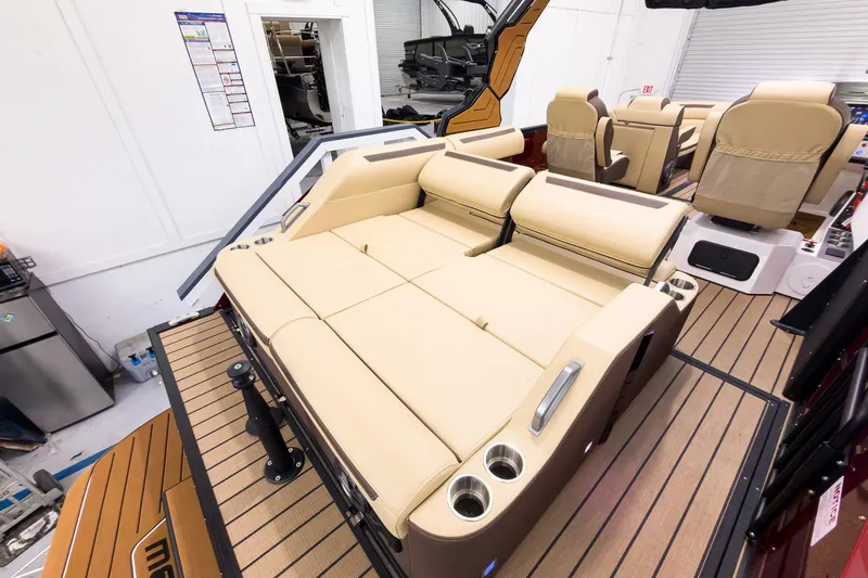 Slide: The Image of Luxurious interior of 2026 Montara Surf Boss EVO - SL 25' boat with beige seating. - 24