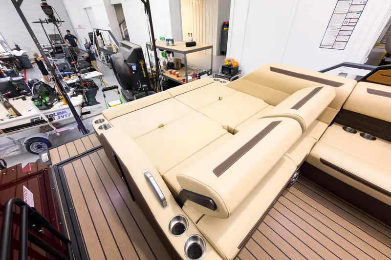 Slide: The Image of Luxurious interior of 2026 Montara Surf Boss EVO - SL 25' boat in a workshop. - 23