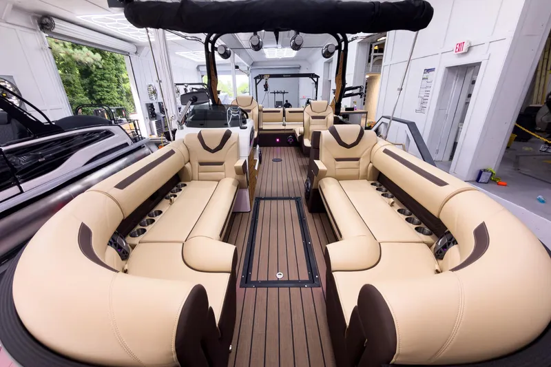 Slide: The Image of Luxurious interior of 2026 Montara Surf Boss EVO - SL 25' boat with plush seating. - 9