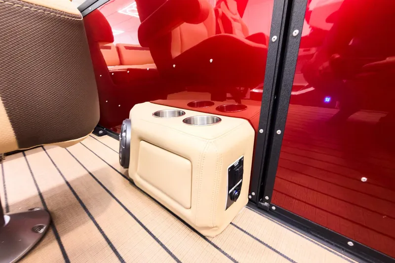 Slide: The Image of Interior of 2026 Montara Surf Boss EVO - SL 25' with cup holders and red paneling. - 18