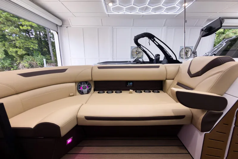 Slide: The Image of Luxurious interior of 2026 Montara Surf Boss EVO - SL 25' boat with beige seating. - 10