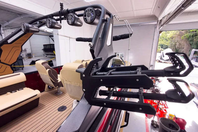 Slide: The Image of 2026 Montara Surf Boss EVO - SL 25' interior with seating and equipment in a garage setting. - 30