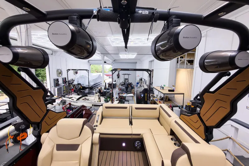 Slide: The Image of 2026 Montara Surf Boss EVO - SL 25' boat interior with premium seating and Boston Acoustics speakers. - 20
