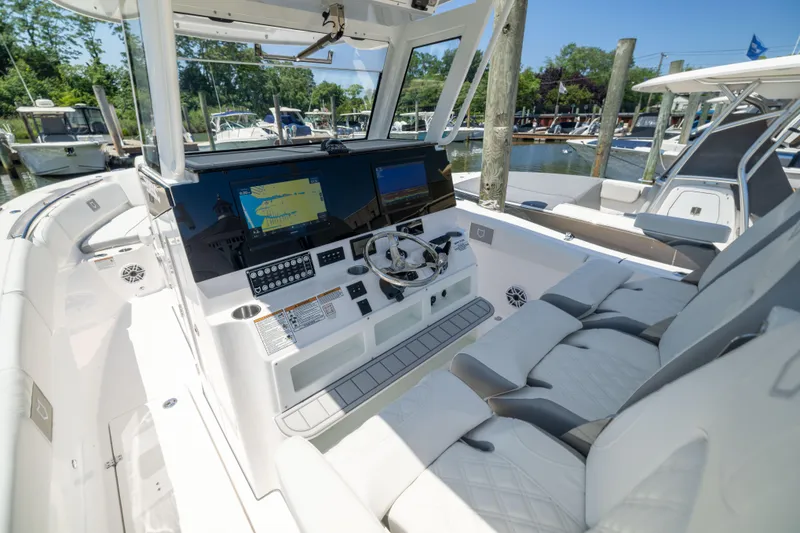 Slide: The Image of The image shows the cockpit of a 2027 Sea Fox 328 Commander with modern instruments. - 27
