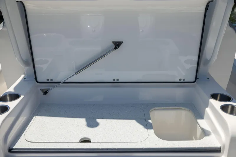 Slide: The Image of The image shows an open cooler on a boat with cup holders. - 11