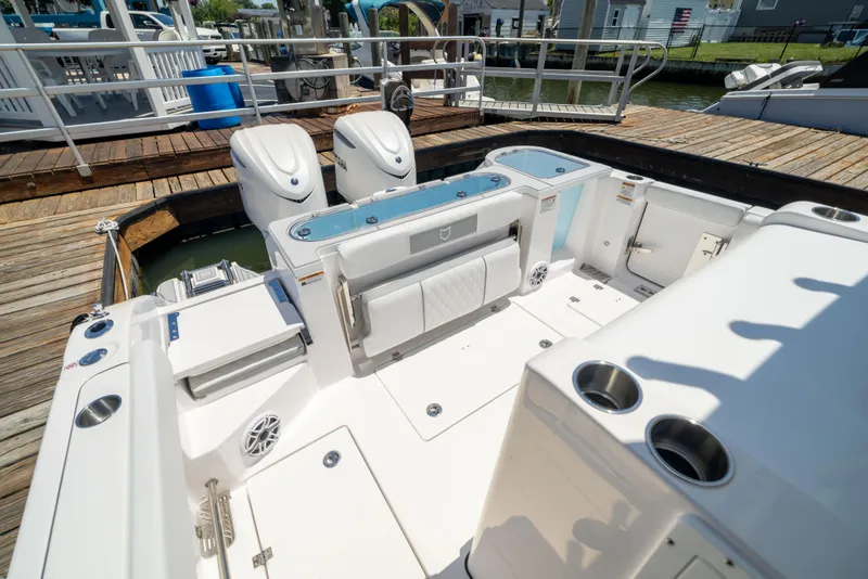 Slide: The Image of The image shows the cockpit of a Sea Fox 328 Commander with two outboard engines. - 7