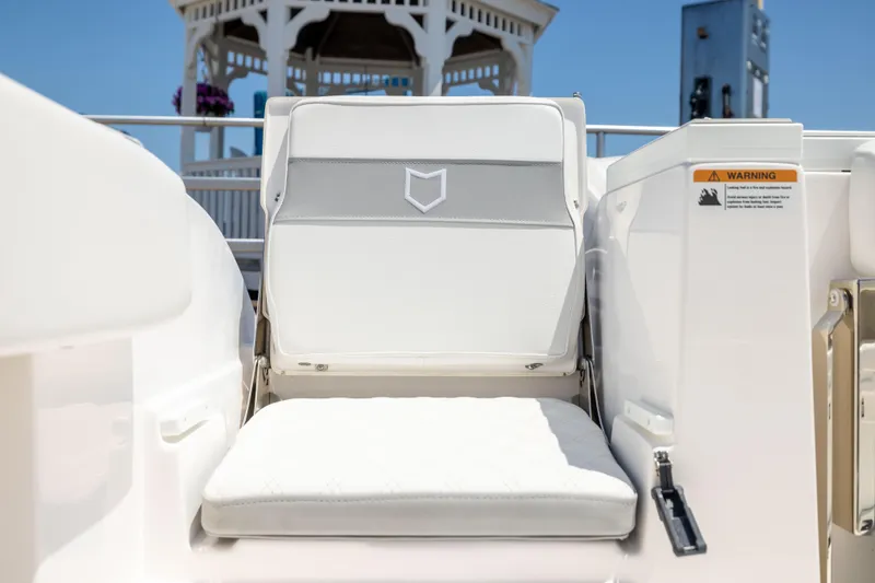 Slide: The Image of A white seat on a boat with a gazebo in the background. - 5
