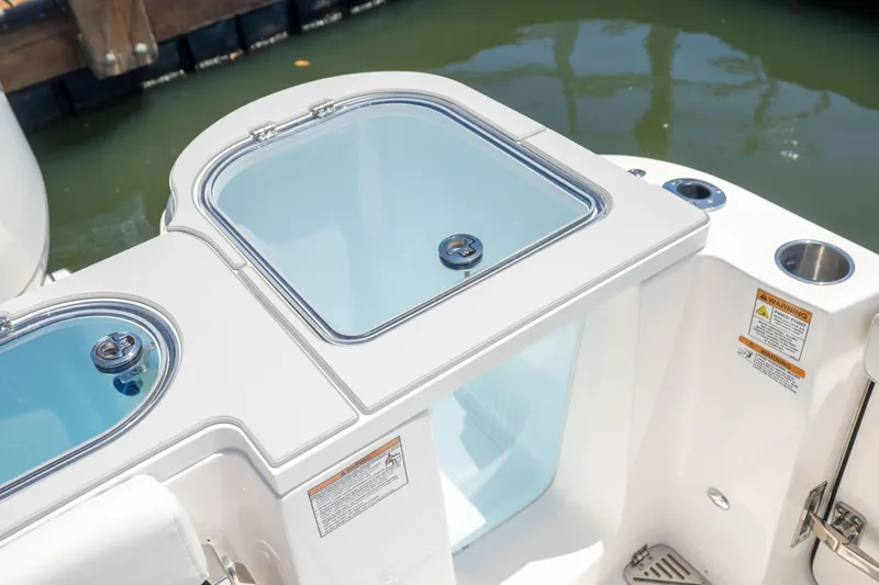 Slide: The Image of The image shows part of a boat with two round, clear covers and water beneath. - 21