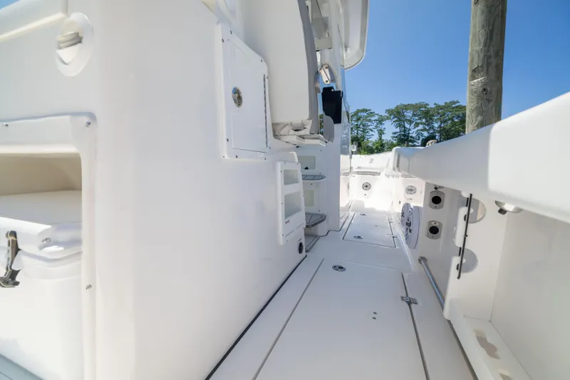 Slide: The Image of Sea Fox 328 Commander 2027: Spacious deck with white interior and clear blue sky. - 23