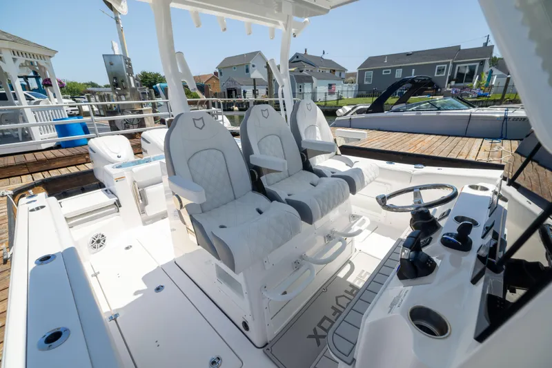 Slide: The Image of Interior of a Sea Fox 328 Commander with luxurious seats and helm console. - 36