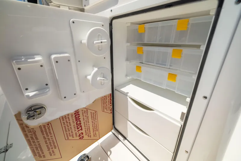 Slide: The Image of Storage compartment with drawers and shelves on a boat. - 25