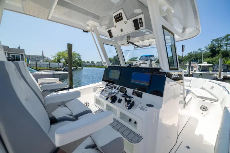 Slide: The Image of The cockpit of a 2027 Sea Fox 328 Commander with modern instruments and comfortable seating. - 31