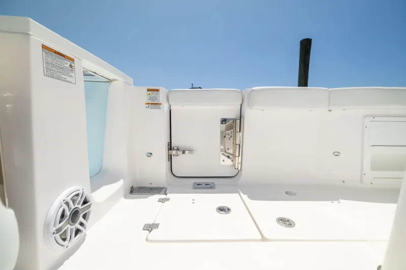 Slide: The Image of The image shows the deck of a Sea Fox 328 Commander boat with white surfaces. - 20