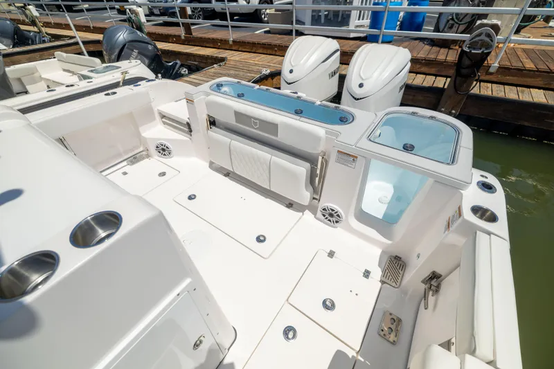 Slide: The Image of The image shows the stern of a Sea Fox 328 Commander with two outboard engines. - 18