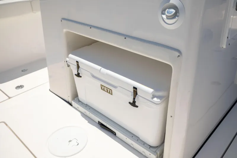 Slide: The Image of A Yeti cooler is stored in a compartment on a Sea Fox 328 Commander boat. - 22