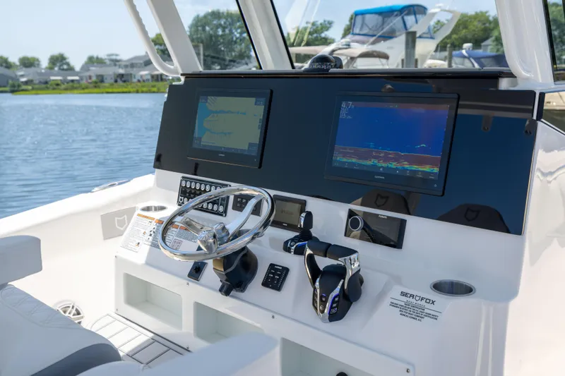 Slide: The Image of The image shows the cockpit of a Sea Fox 328 Commander with modern navigation systems. - 32