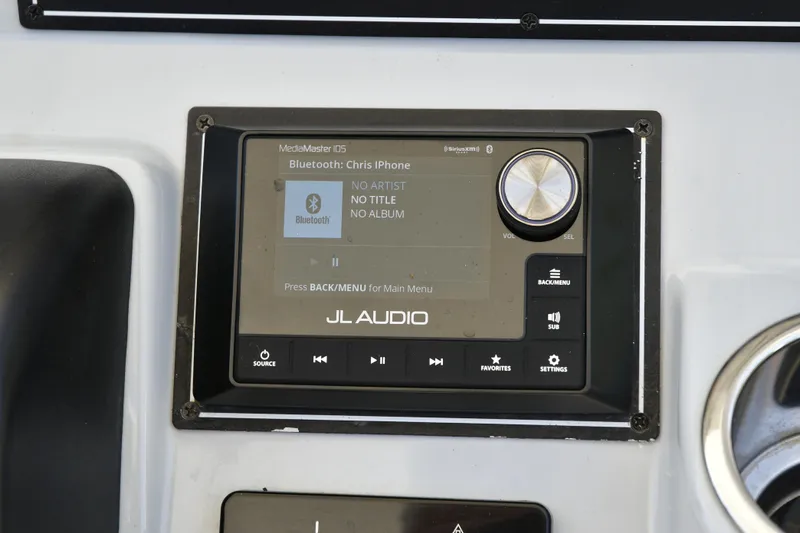 Slide: The Image of JL Audio MediaMaster 105 on 2020 Pursuit C 238 Center Console boat dashboard. - 13