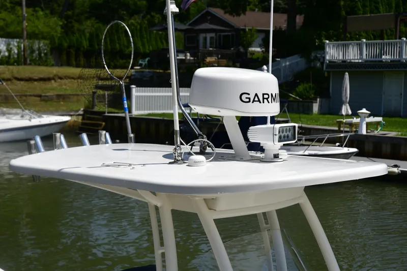 Slide: The Image of 2020 Pursuit C 238 Center Console with Garmin radar and spotlight on top. - 14