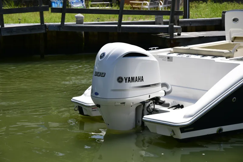 Slide: The Image of 2020 Pursuit C 238 Center Console with Yamaha outboard motor in water. - 7