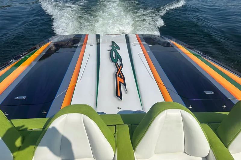 Slide: The Image of High-speed Skater 46 boat with vibrant stripes, cruising on water, 2013 model. - 13
