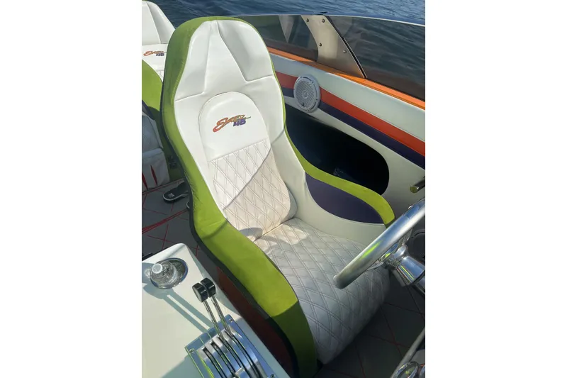 Slide: The Image of Luxurious Skater 46 boat seat with green accents, 2013 model, featuring quilted design. - 14