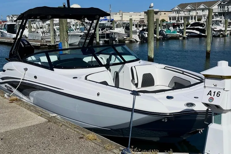 The Image of 2024 Monterey M-65 boat docked at marina, featuring sleek design and modern amenities. - 1
