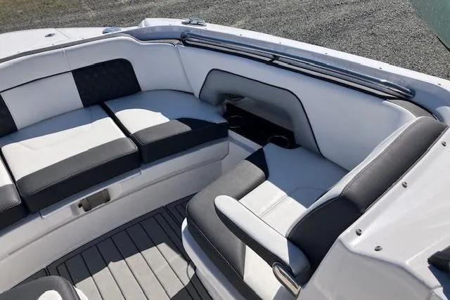 Slide: The Image of Luxurious seating area on 2024 Monterey M-65 boat with sleek black and white upholstery. - 20
