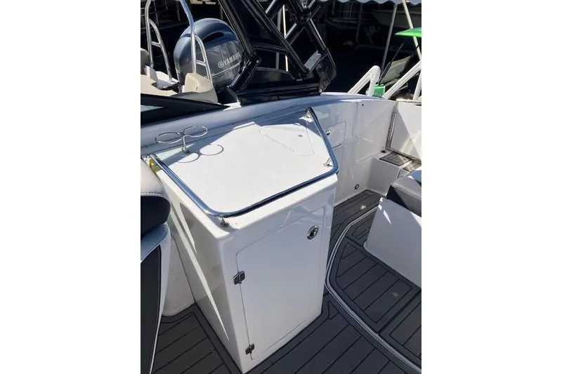 Slide: The Image of 2024 Monterey M-65 boat interior with sleek white cabinetry and modern design. - 13