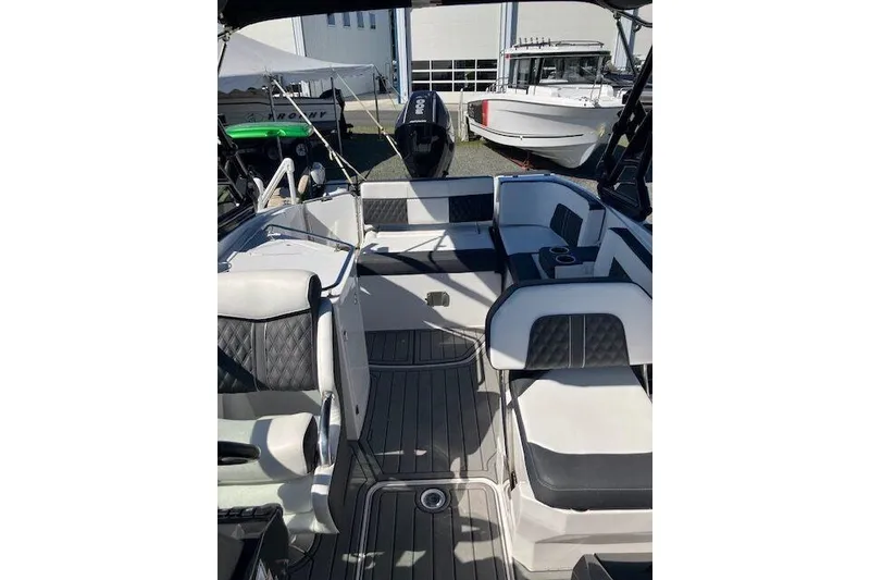 Slide: The Image of 2024 Monterey M-65 boat interior with sleek seating and modern design. - 14