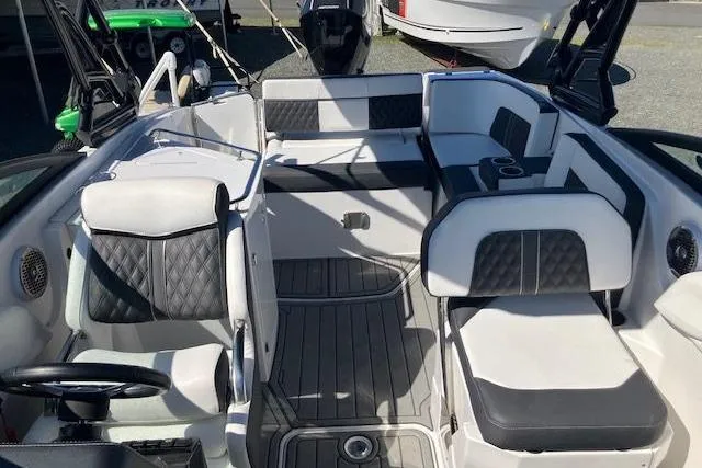 Slide: The Image of 2024 Monterey M-65 boat interior with sleek seating and modern design. - 15