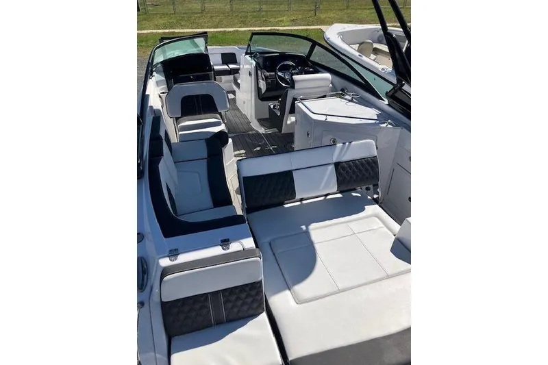 Slide: The Image of 2024 Monterey M-65 boat interior with sleek seating and modern dashboard design. - 7