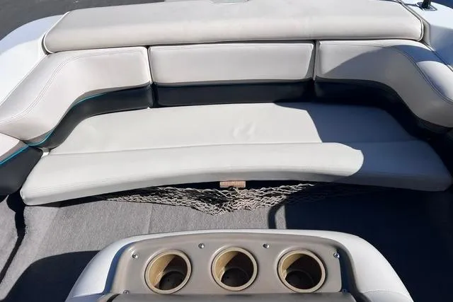Slide: The Image of 1996 MasterCraft ProStar 190 interior with cushioned seating and cup holders. - 10